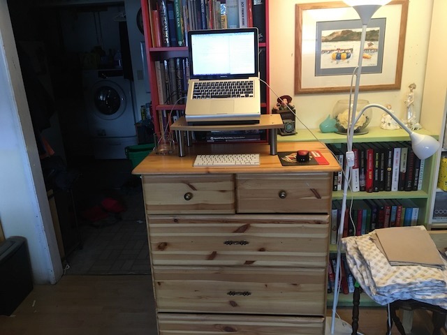 Standing at a dresser